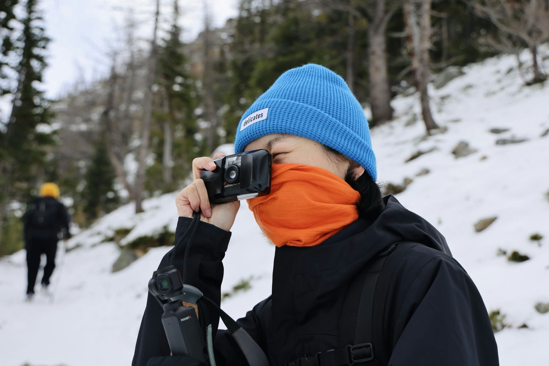 Film camera and snowy mountains